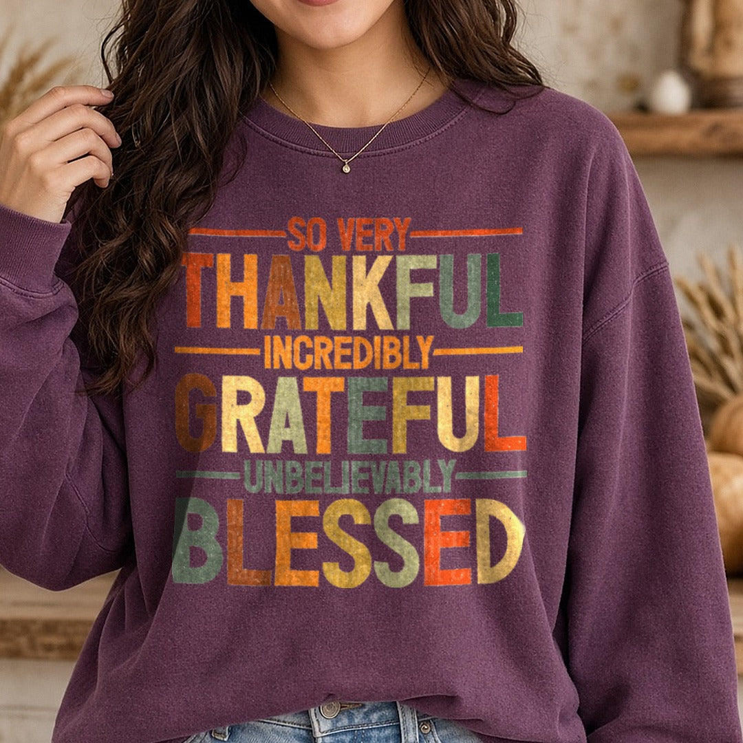 So Very Thankful Incredibly Grateful Unbelievably Blessed DTF transfer shown on a Comfort Colors sweatshirt