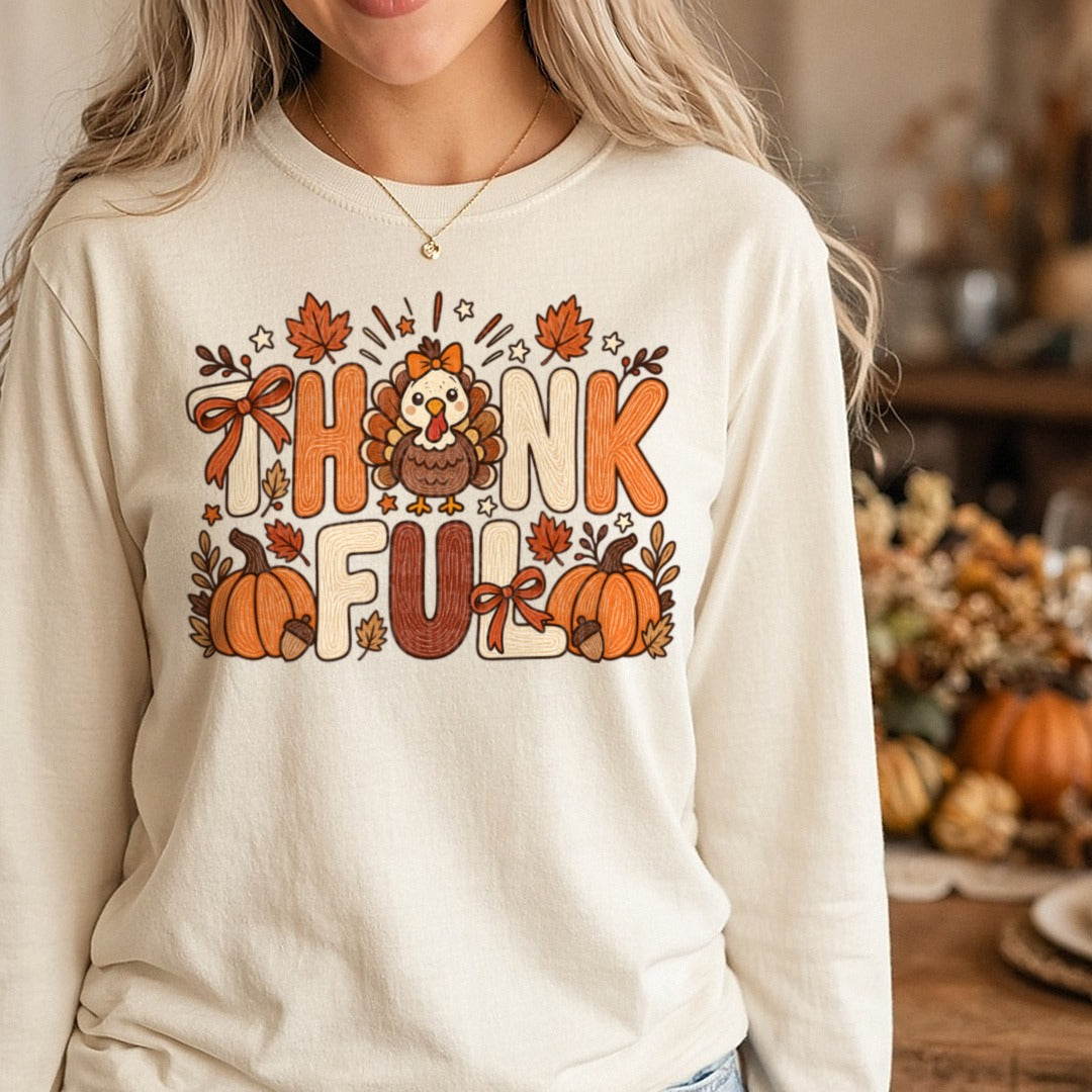 Thankful Turkey Bows Pumpkins Retro Letters DTF transfer shown on a Comfort Colors long sleeve tee