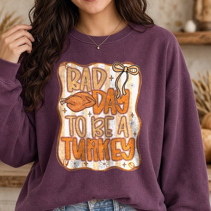 Bad Day to be a Turkey DTF transfer shown on a Comfort Colors sweatshirt