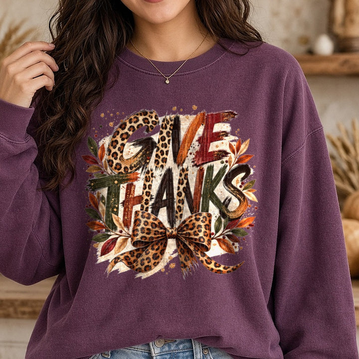 Give Thanks Leopard DTF transfer shown on a Comfort Colors sweatshirt