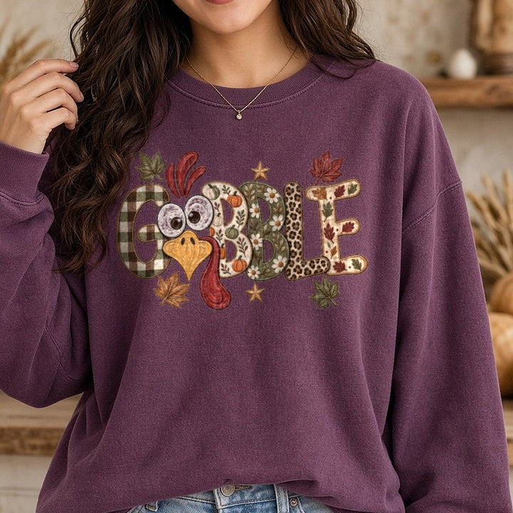 Gobble Turkey Face DTF transfer shown on a Comfort Colors sweatshirt