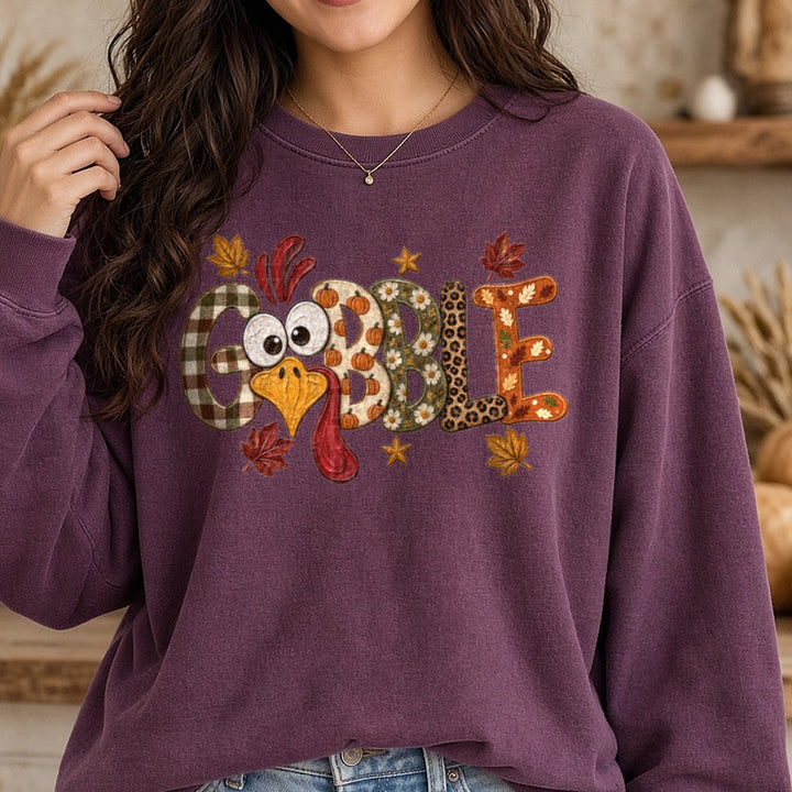 Gobble Turkey Face 2 DTF transfer shown on a Comfort Colors sweatshirt