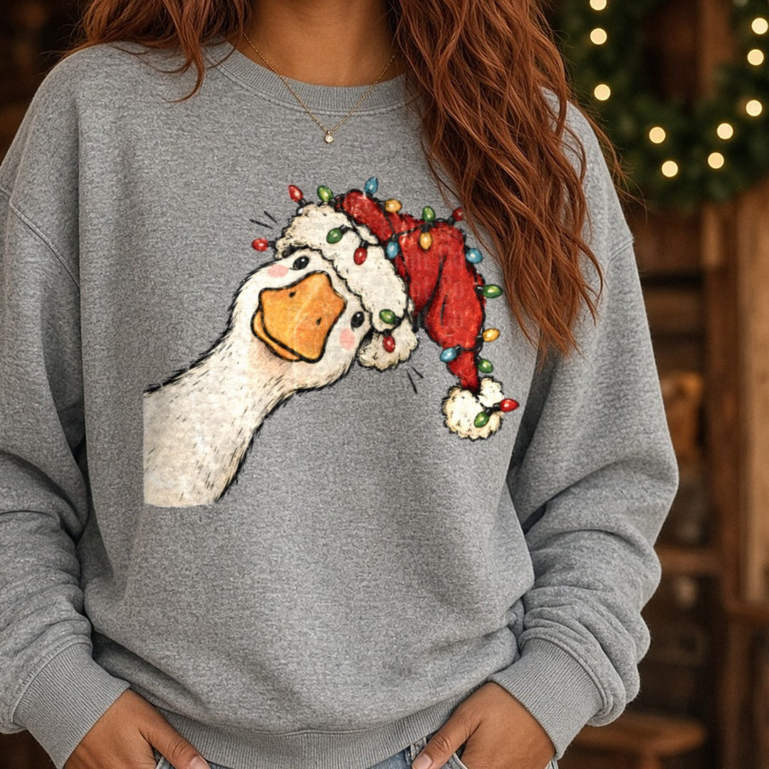 Christmas Light Goose DTF transfer shown on a Comfort Colors sweatshirt