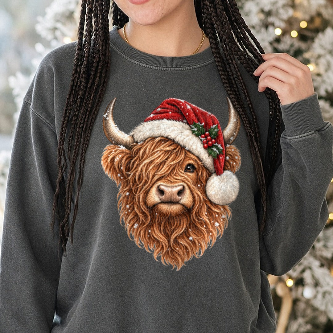 Highland Cow Christmas DTF transfer shown on a Comfort Colors sweatshirt