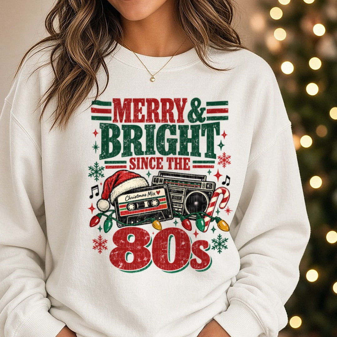 Merry & Bright Since The 80's DTF transfer shown on a Comfort Colors sweatshirt