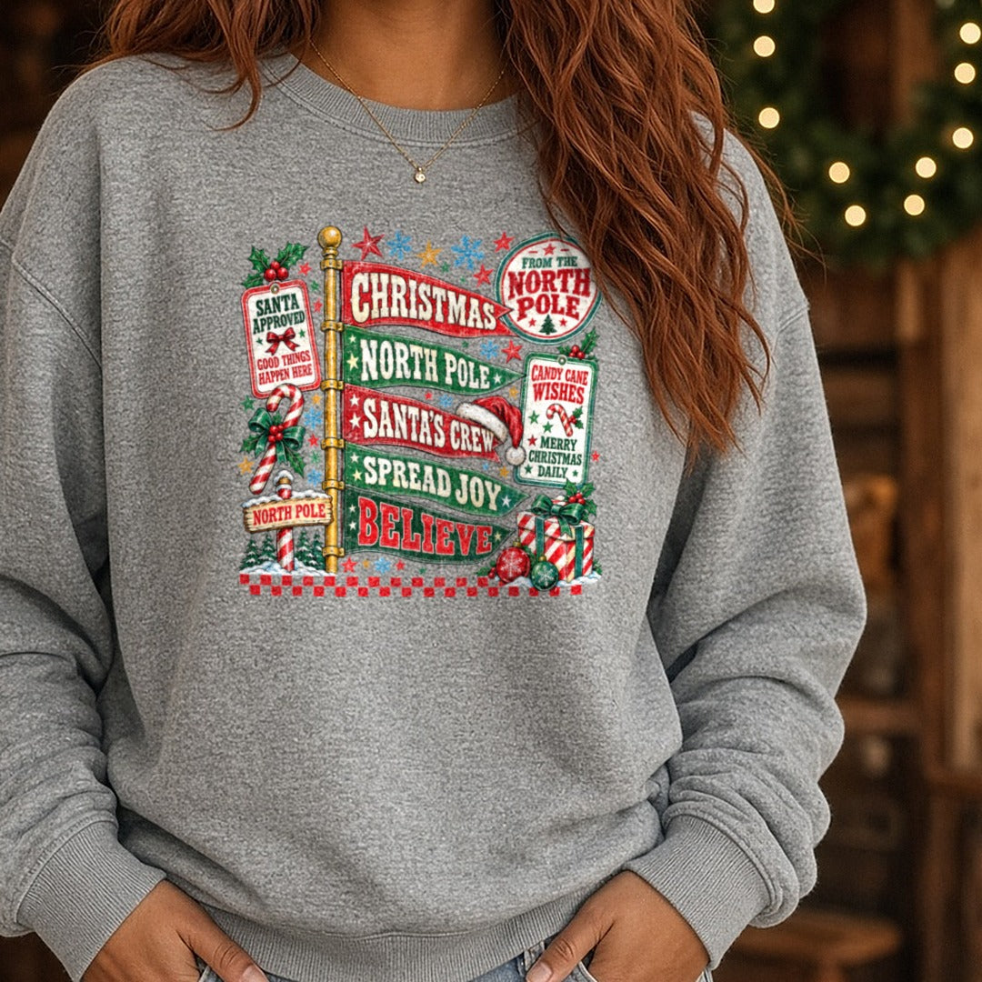 Preppy North Pole Christmas DTF transfer shown on a Comfort Colors sweatshirt
