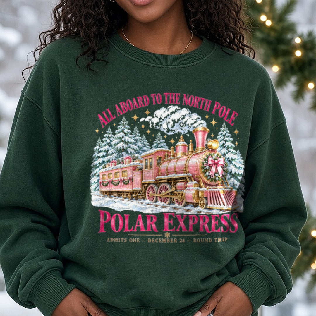 Pink Polar Express Christmas DTF transfer shown on a Comfort Colors sweatshirt