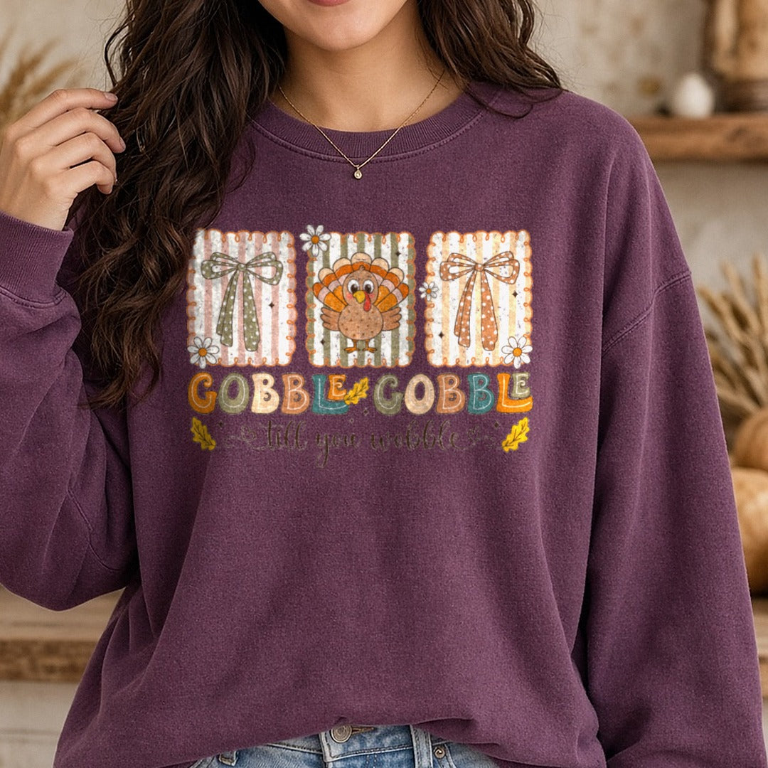 Gobble Till You Wobble DTF transfer shown on a Comfort Colors sweatshirt