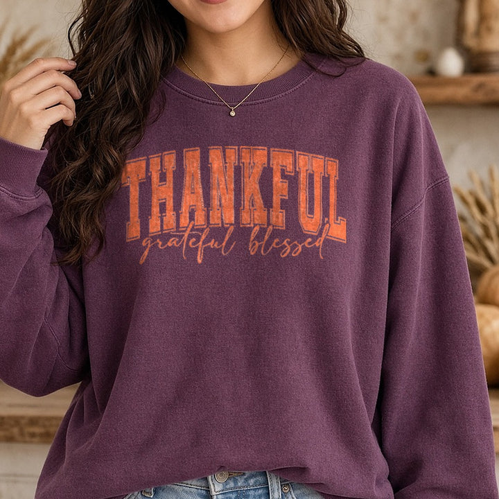 Thankful Grateful Blessed Orange DTF transfer shown on a Comfort Colors sweatshirt