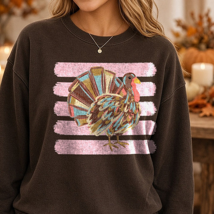 Colorful Boho Thanksgiving Turkey Pink Stripe Background DTF transfer shown on a Comfort Colors sweatshirt
