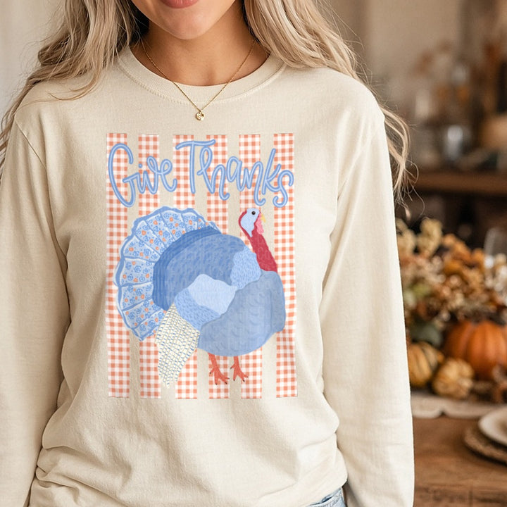 Give Thanks Floral Turkey on Orange Gingham DTF transfer shown on a Comfort Colors long sleeve tee