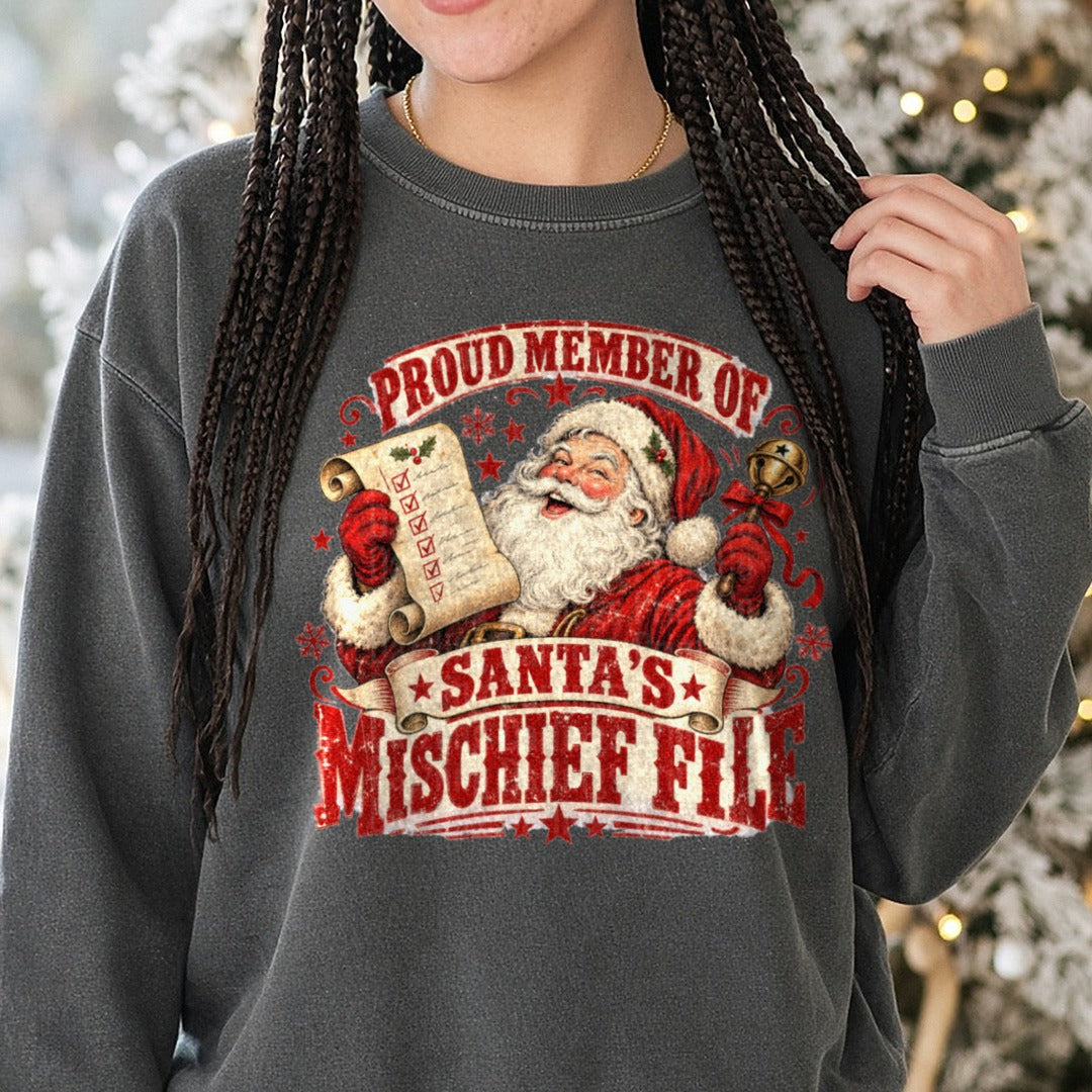 Proud Member of Santa's Mischief File DTF transfer shown on a Comfort Colors sweatshirt
