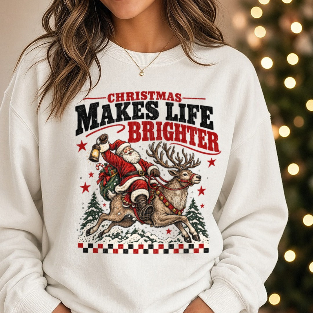 Christmas Makes Life Brighter DTF transfer shown on a Comfort Colors sweatshirt