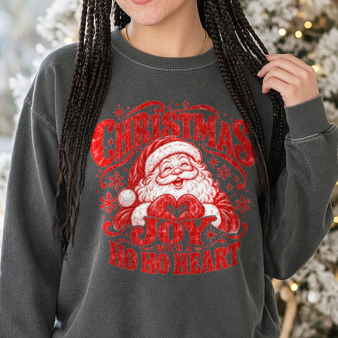 Christmas Joy with a HO HO Heart DTF transfer shown on a Comfort Colors sweatshirt