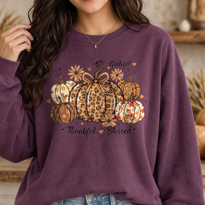 Grateful Thankful Blessed Leopard DTF transfer shown on a Comfort Colors sweatshirt