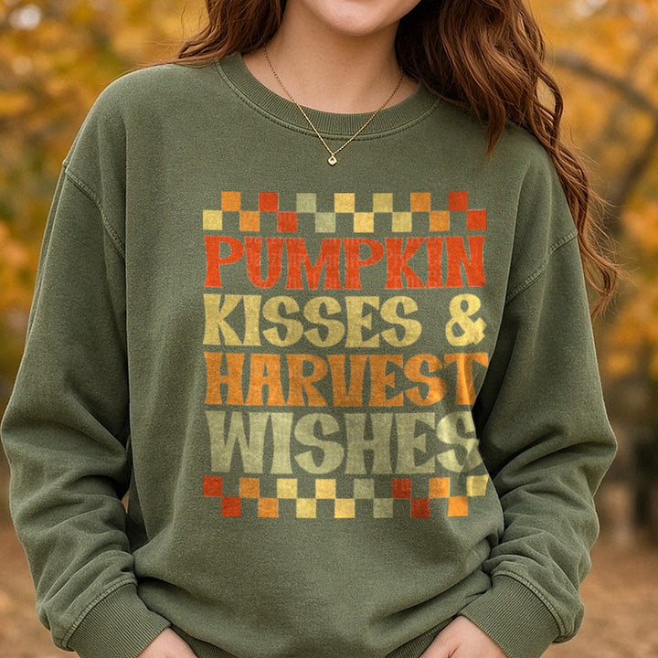 Pumpkin Kisses & Harvest Wishes Checkered DTF transfer shown on a Comfort Colors sweatshirt