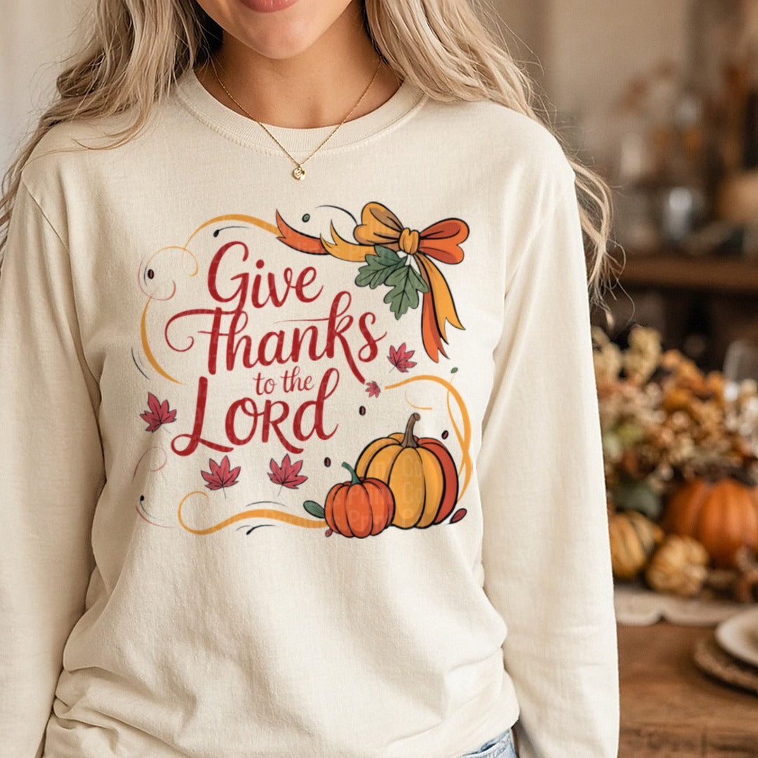 Give Thanks To The Lord Red Script Orange Bow Pumpkin DTF transfer shown on a Comfort Colors long sleeve tee