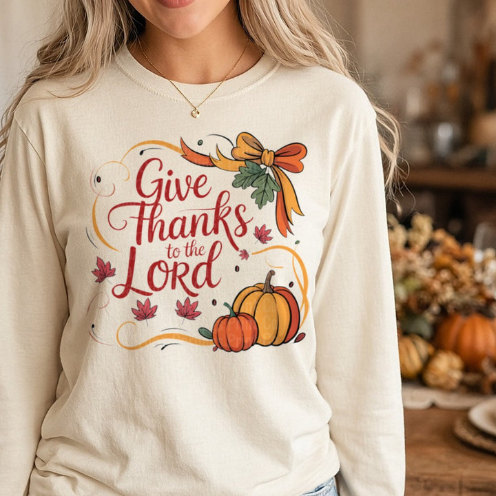 Give Thanks To The Lord Red Script Orange Bow Pumpkin DTF transfer shown on a Comfort Colors long sleeve tee