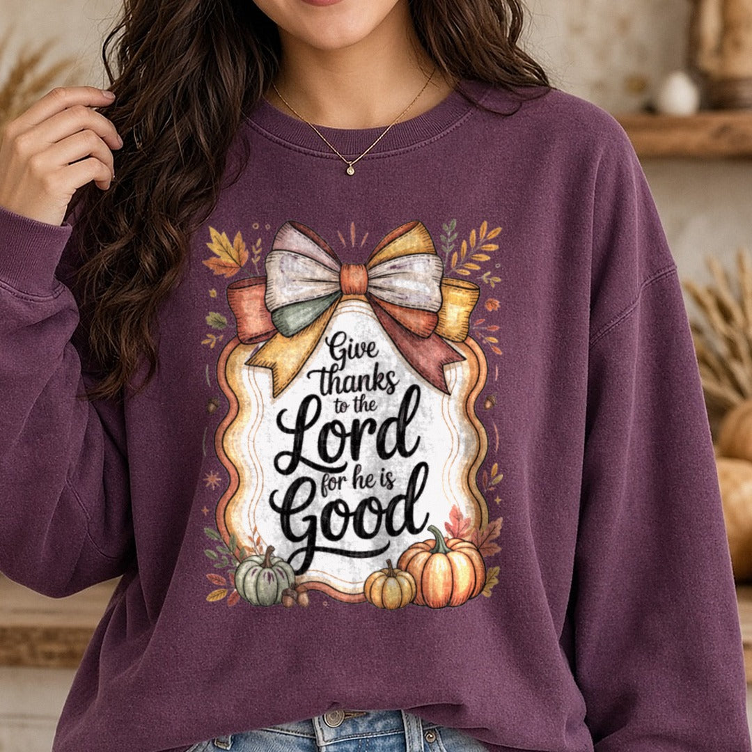Give Thanks To The Lord For He Is Good Coquette Bow Frame DTF transfer shown on a Comfort Colors sweatshirt