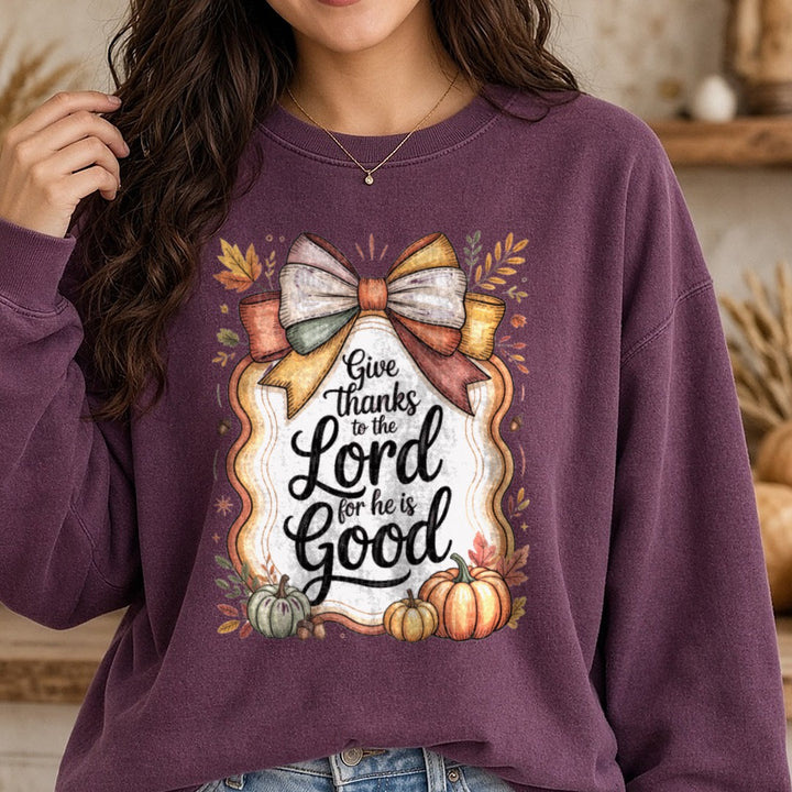 Give Thanks To The Lord For He Is Good Coquette Bow Frame DTF transfer shown on a Comfort Colors sweatshirt