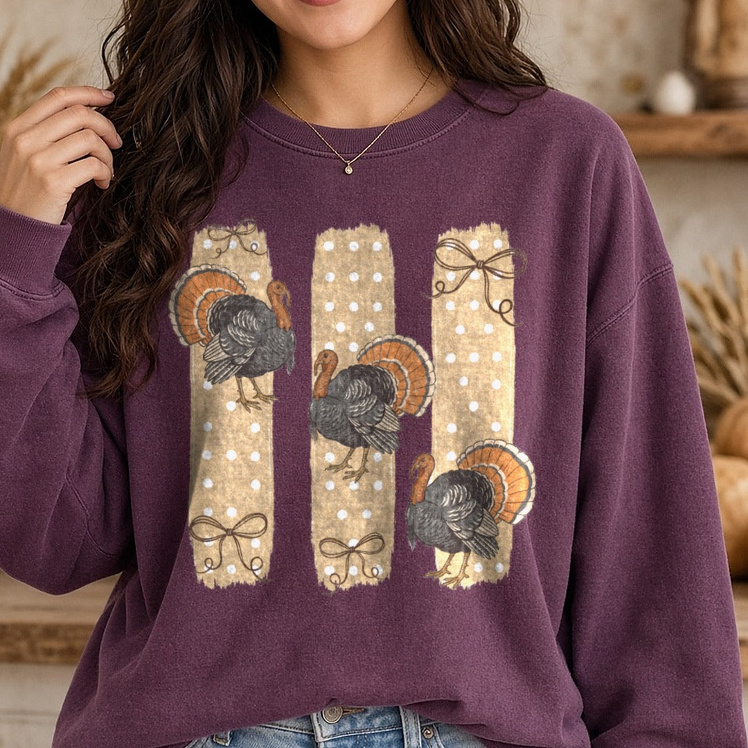 Striped Polkadot Turkey and Bows DTF transfer shown on a Comfort Colors sweatshirt