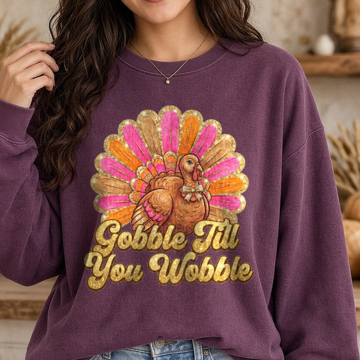 Pink and Orange Gobble till You Wobble DTF transfer shown on a Comfort Colors sweatshirt