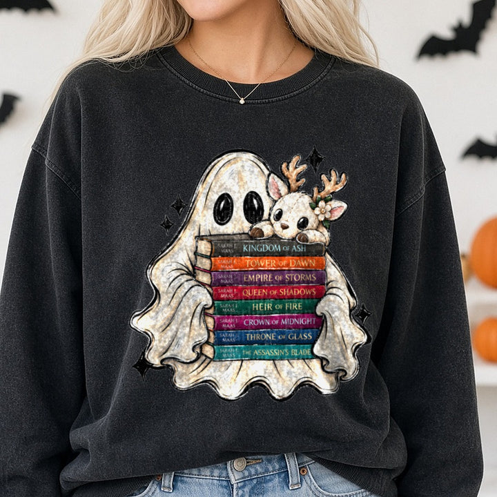 Cute Ghost and Deer Plushie Hugging Sarah J. Maas Throne of Glass Book Stack DTF transfer shown on a Comfort Colors sweatshirt