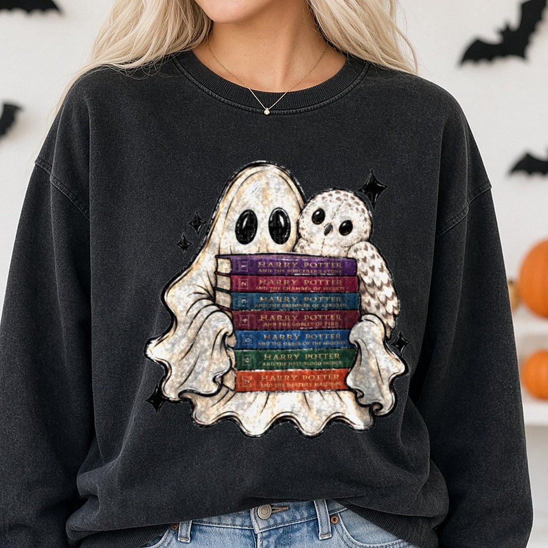 Cute Ghost Hugging Harry Potter Book Series with Hedwig Owl DTF transfer shown on a Comfort Colors sweatshirt
