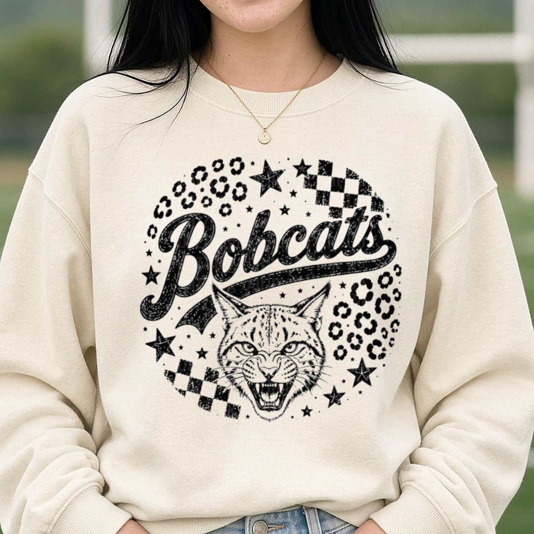 Bobcats Script Mascot Roaring Bobcat Leopard Print Stars DTF transfer shown on a Comfort Colors sweatshirt