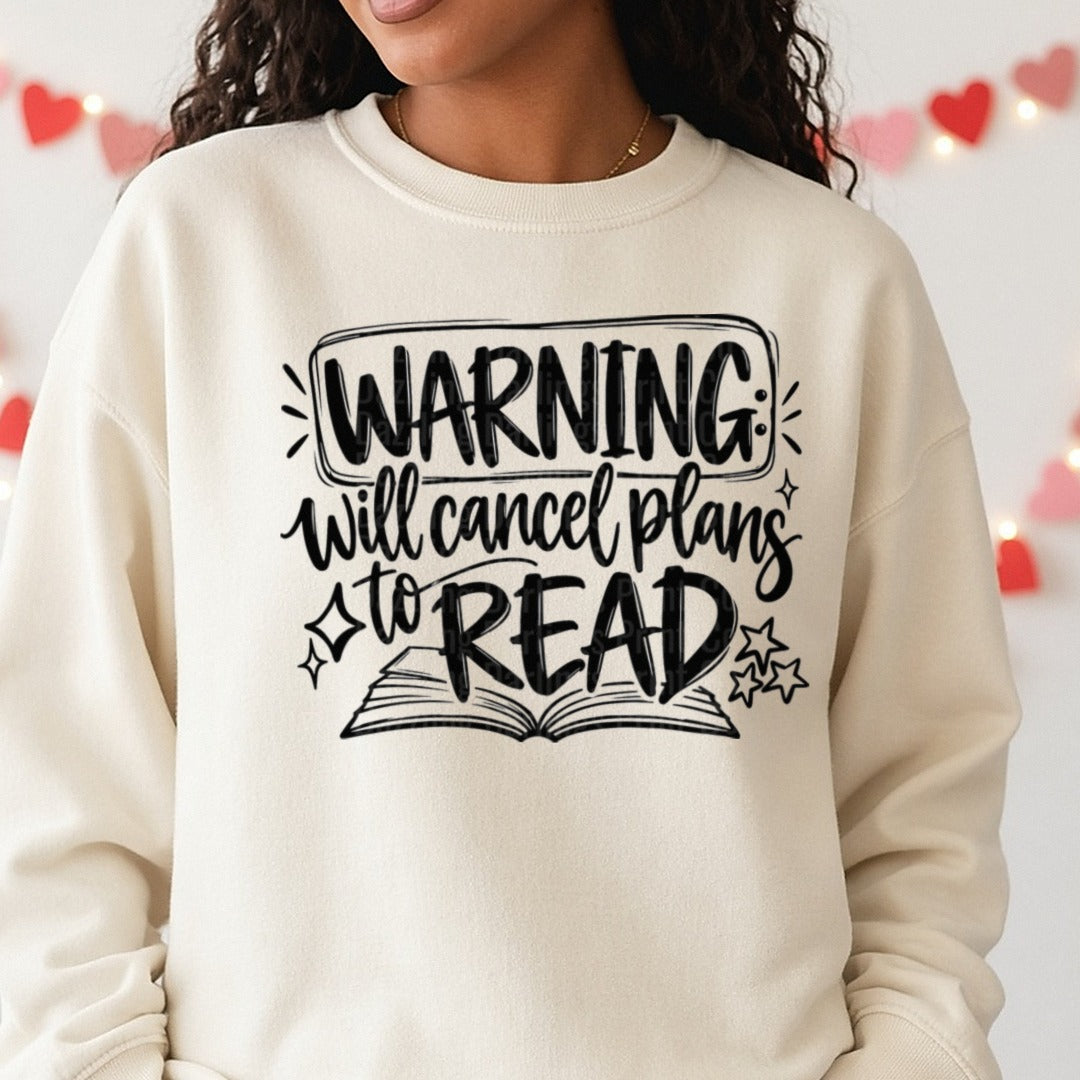 Warning Will Cancel Plans To Read Book Lover Quote DTF transfer shown on a Comfort Colors sweatshirt