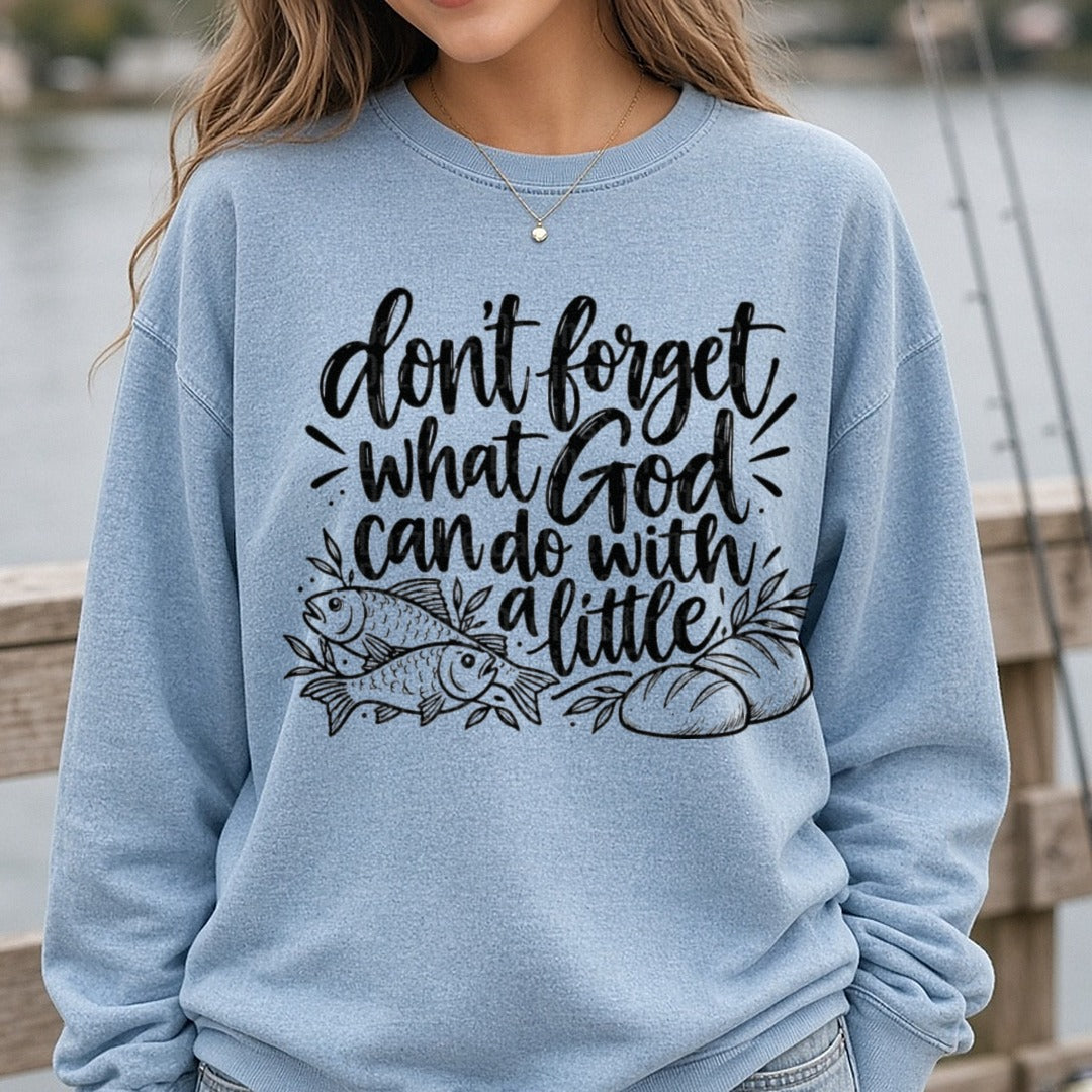 Don't Forget What God Can Do With A Little Loaves Fish DTF transfer shown on a Comfort Colors sweatshirt