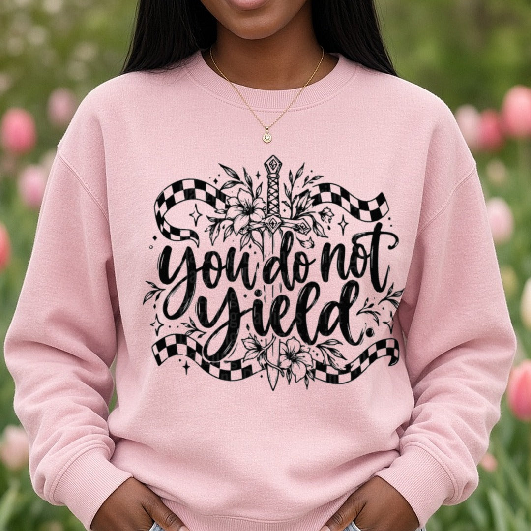 You Do Not Yield Floral Sword Checkered Banner Quote DTF transfer shown on a Comfort Colors sweatshirt