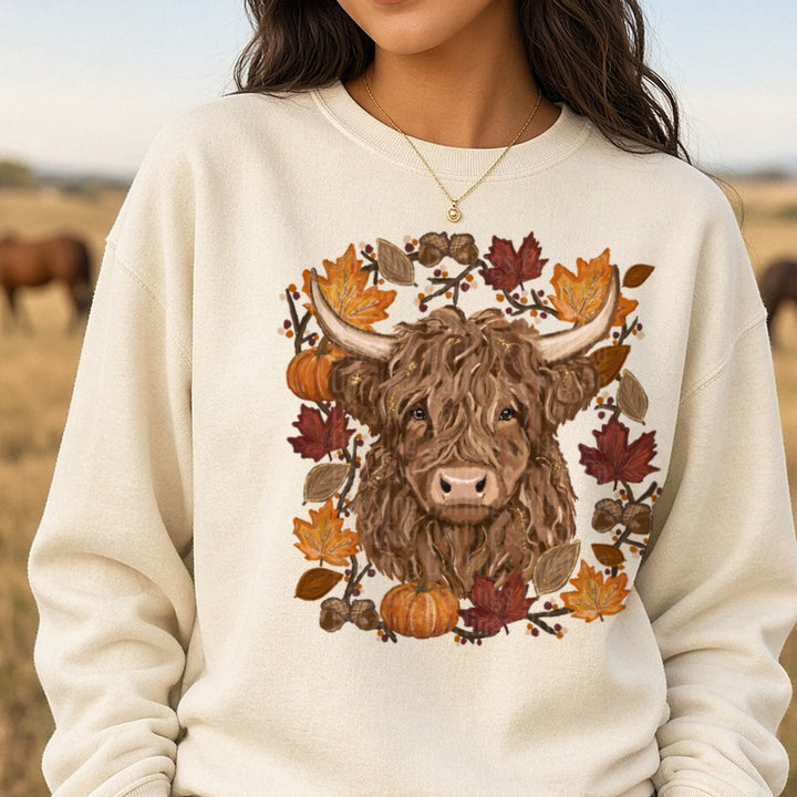 Highland Cow Fall Autumn Wreath Pumpkins Acorns Leaves DTF transfer shown on a Comfort Colors sweatshirt
