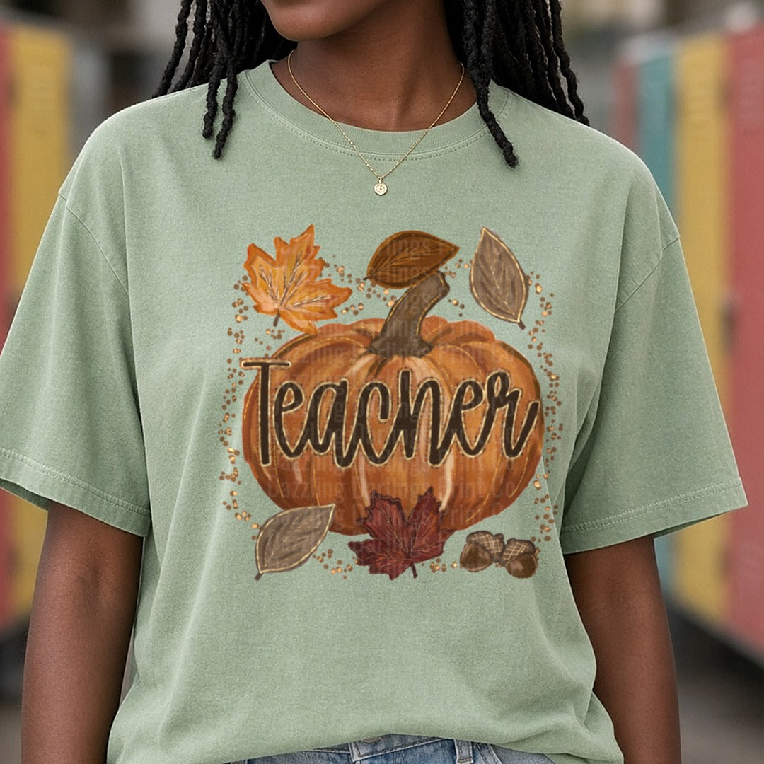 Fall Pumpkin Teacher Script Autumn Leaves Acorns Gold Dots DTF transfer shown on a Comfort Colors tee