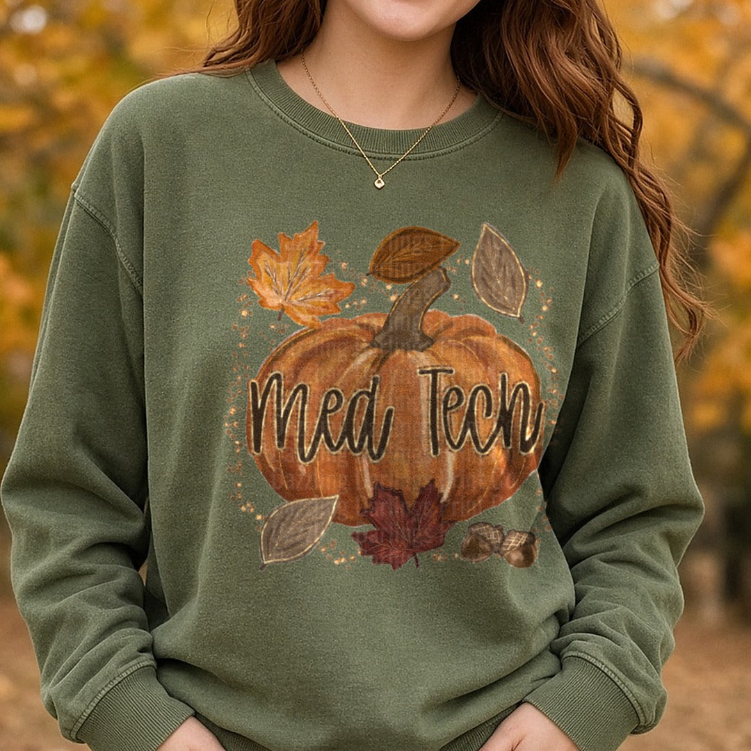Med Tech Fall Pumpkin with Autumn Leaves and Acorns DTF transfer shown on a Comfort Colors sweatshirt