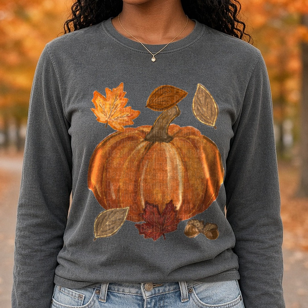 Autumn Harvest Pumpkin with Fall Leaves and Acorns DTF transfer shown on a Comfort Colors long sleeve tee