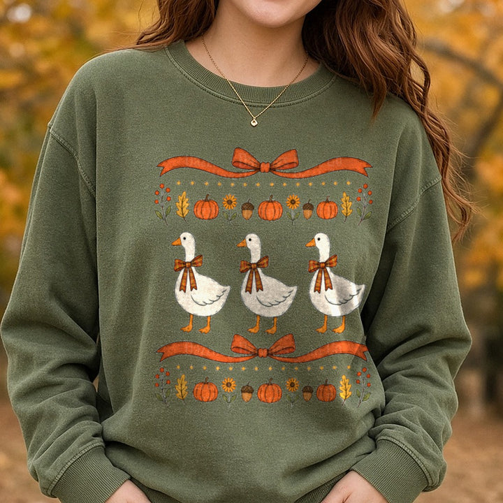 Three Fall Geese with Plaid Bows Pumpkins Autumn Border DTF transfer shown on a Comfort Colors sweatshirt