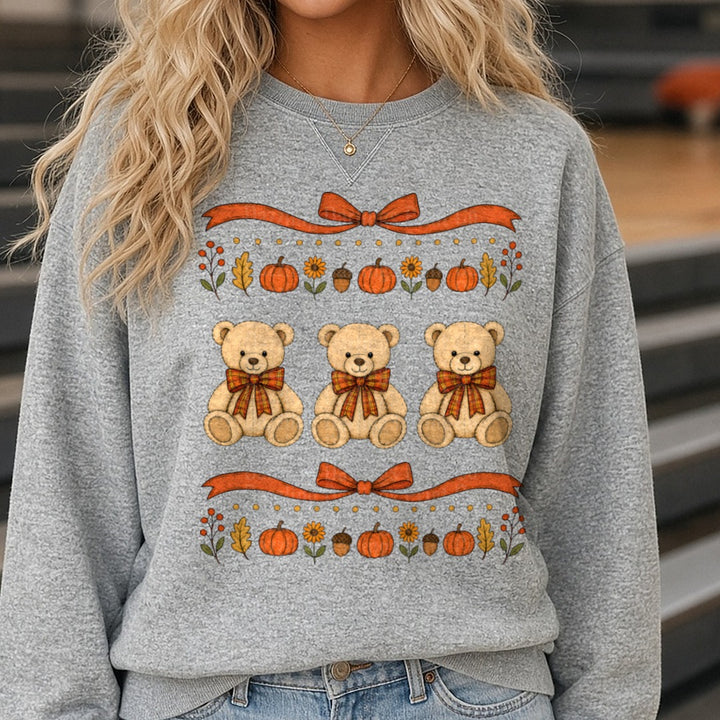 Three Fall Teddy Bears Plaid Bows Pumpkins Autumn Border DTF transfer shown on a Comfort Colors sweatshirt