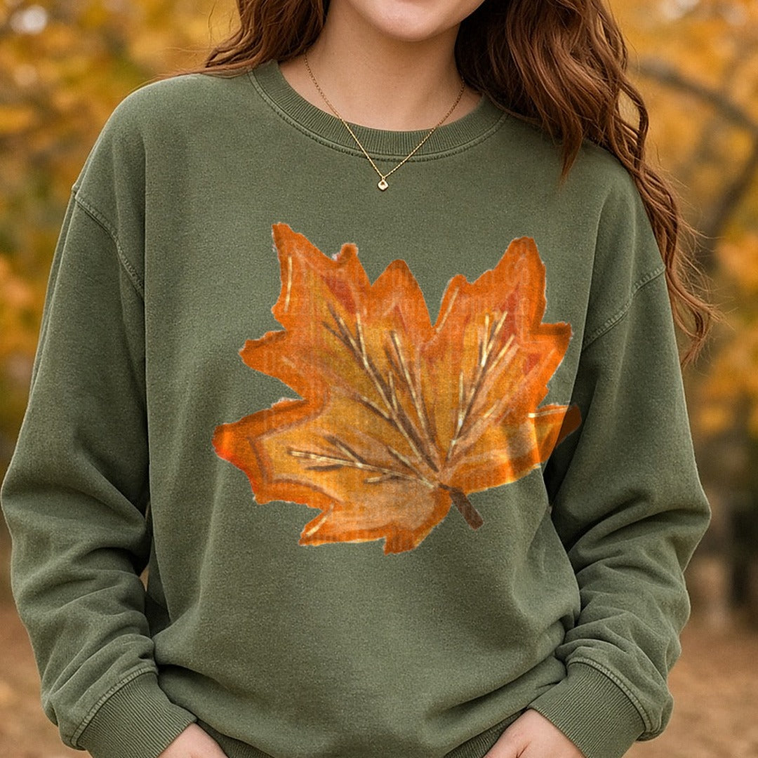 Painted Autumn Maple Leaf Fall Foliage Orange Brushstroke DTF transfer shown on a Comfort Colors sweatshirt
