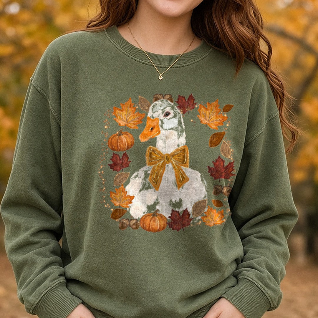 White Goose Gold Bow Fall Autumn Leaves Pumpkins Acorns DTF transfer shown on a Comfort Colors sweatshirt