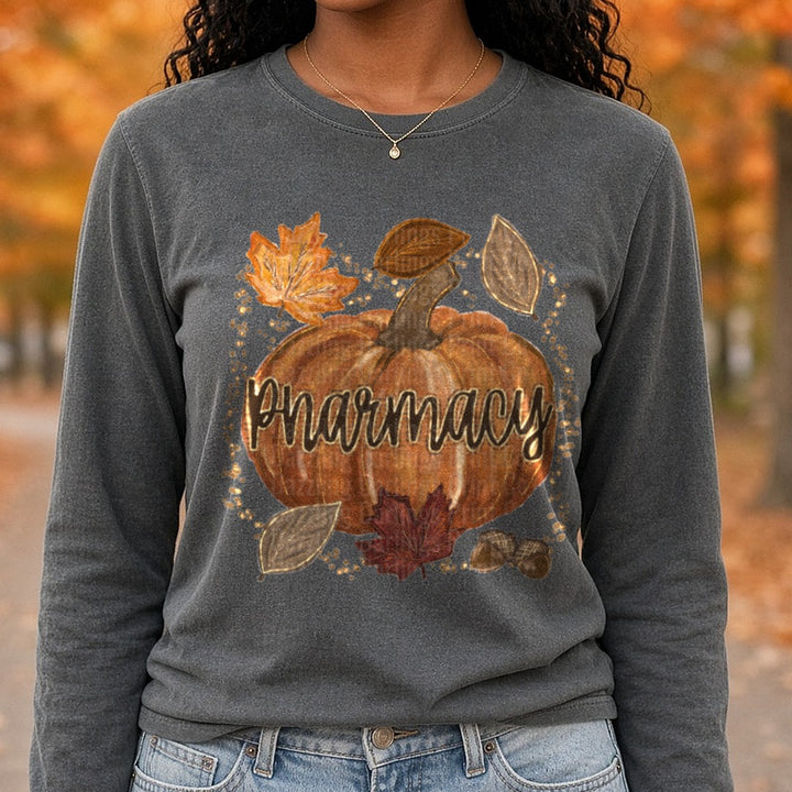 Fall Pumpkin Pharmacy Autumn Leaves Acorns Gold Glitter DTF transfer shown on a Comfort Colors long sleeve tee