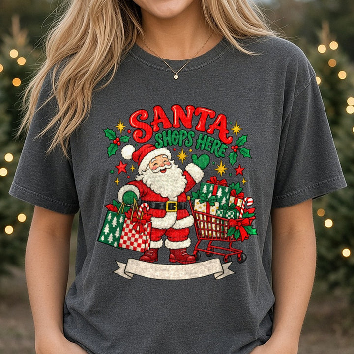 Santa Shops Here Holiday Shopping Cart Gift Bags Design DTF transfer shown on a Comfort Colors tee