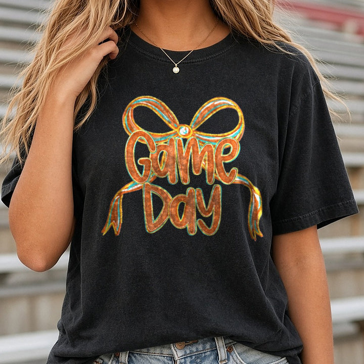 Game Day Football Coquette Bow DTF transfer shown on a Comfort Colors tee