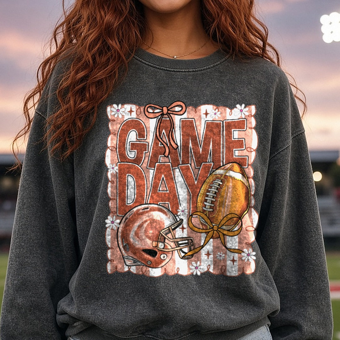 Game Day Football Brown Stripes Helmet Bow DTF transfer shown on a Comfort Colors sweatshirt