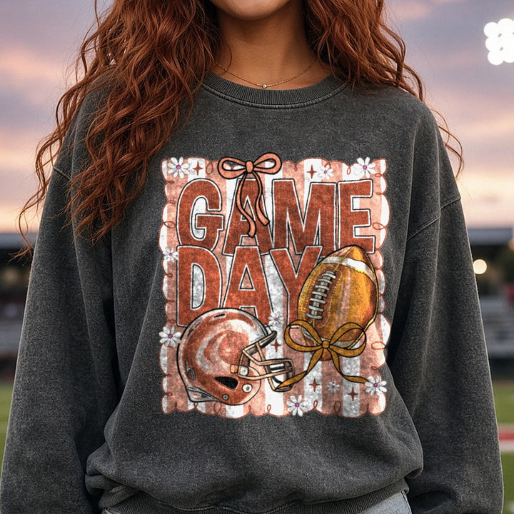Game Day Football Brown Stripes Helmet Bow DTF transfer shown on a Comfort Colors sweatshirt