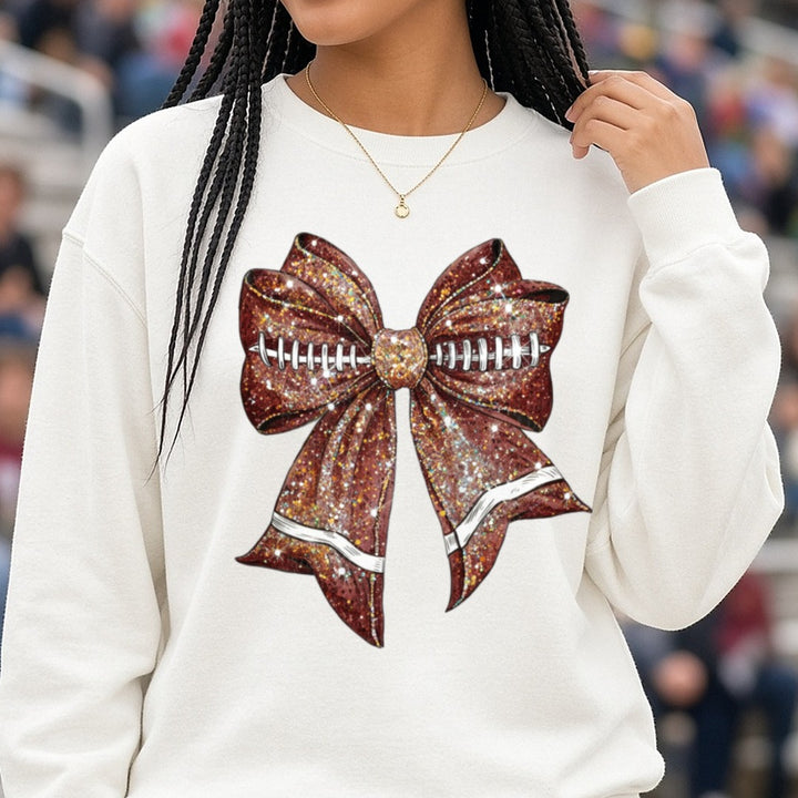 Glitter Football Coquette Bow DTF transfer shown on a Comfort Colors sweatshirt