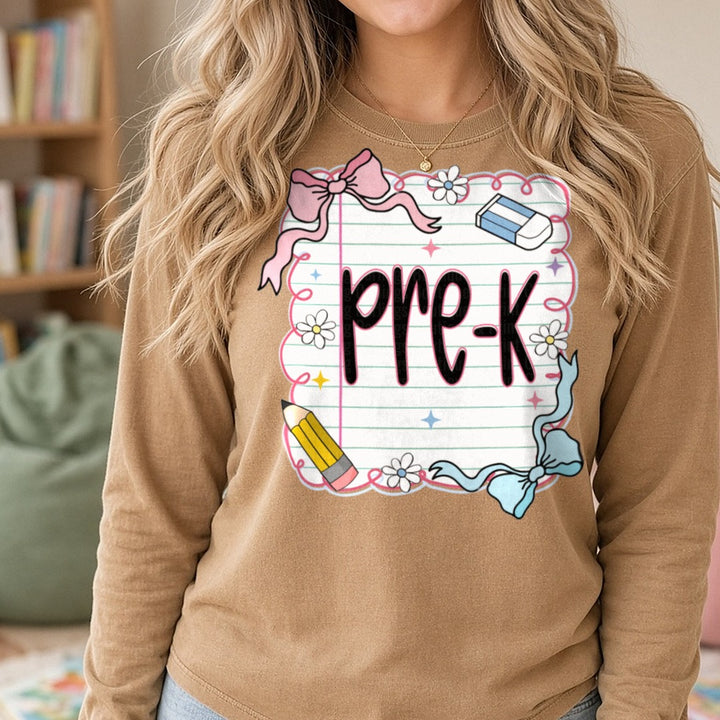 Back To School Pre-K Notebook Paper Pink Bow Pencil DTF transfer shown on a Comfort Colors long sleeve tee