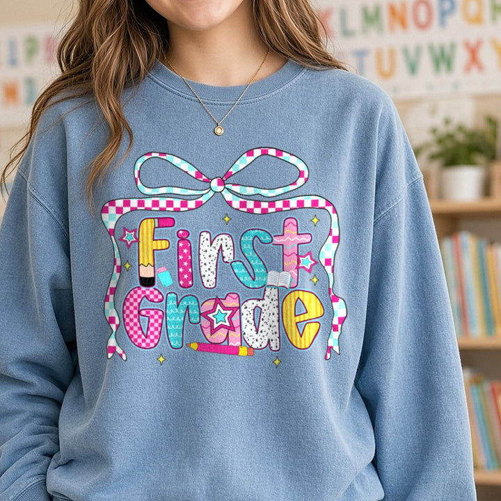 Back to School First Grade DTF transfer shown on a Comfort Colors sweatshirt
