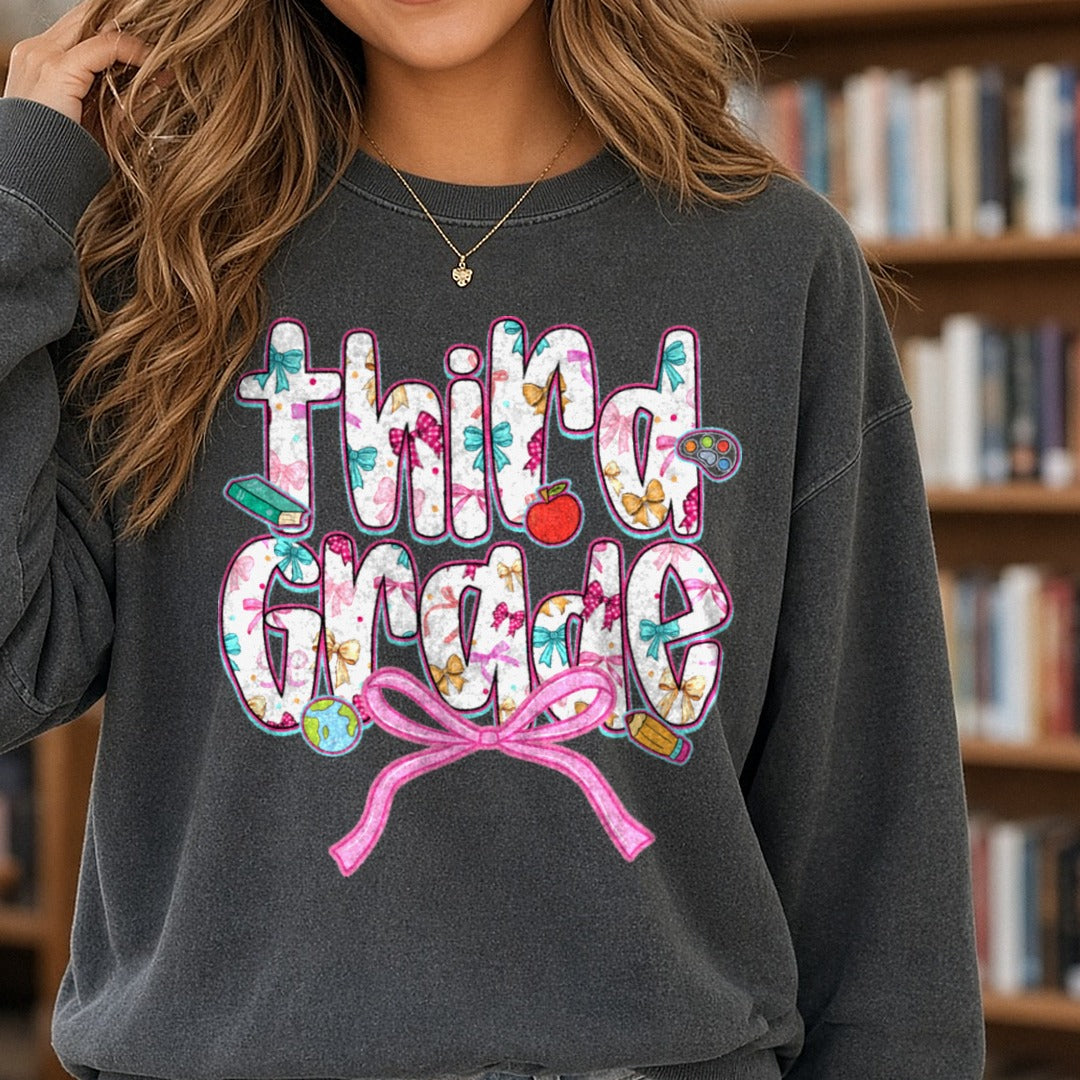 Back To School Third Grade Floral Letters Pink Bow Apple DTF transfer shown on a Comfort Colors sweatshirt