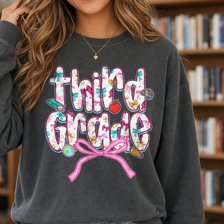 Back To School Third Grade Floral Letters Pink Bow Apple DTF transfer shown on a Comfort Colors sweatshirt